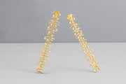 Todd Reed earrings with White brilliant cut diamonds (~.64ct), and 18k yellow gold.